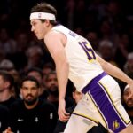 Austin Reaves exits Lakers’ Christmas Day game, set for MRI on left calf