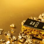 Miners stumble as gold falls, Needham cuts Coinbase price target