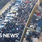 Protests erupt across Iran as currency sinks to record low