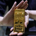 Gold prices dip as investors book profits