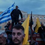 Angry Greek farmers converge on parliament with tractors in overnight protest rally