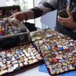 For Olympic athletes and collectors, pin trading has become a sport of its own