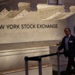 FTSE 100 up and US stocks lower as AI fears plague tech stocks