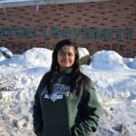 Graduate student guides others on their Binghamton journeys