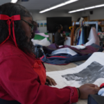 Students prepare to take the runway during CO Beautillion-Cotillion fashion show