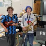 Eighth grade students play music to seniors for service project