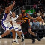 Hawks withstand fourth-quarter surge by Kings in 123-113 victory as Snyder gets 500th win