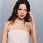 Olivia Rodrigo’s Strapless Mini Dress Lands a Bold Fashion Moment at Oscar Party