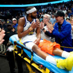 Warriors’ Moses Moody stretchered off court after gruesome knee injury in win over Mavericks