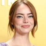 Why Emma Stone’s Red Carpet Cardigan Is Diving the Internet