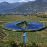 Flying saucer-shaped winery concept hides beneath vineyards in Greece