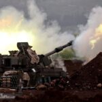 Iran-Israel Strikes Escalate; Greece Sends Defense Minister to London