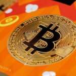 Bitcoin pares gains after touching top of recent trading range