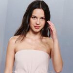 Olivia Rodrigo’s Strapless Mini Dress Lands a Bold Fashion Moment at Oscar Party