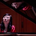 She plays piano in an AI world