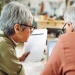 Americans tap retirement funds at record rates as mounting financial stress takes toll