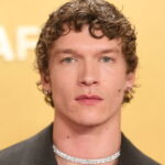 PHOTOS: Connor Storrie goes bareback in scorching spread for his first Vogue cover