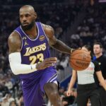 LeBron James has 26 points, 11 assists to lead Lakers past Warriors 119-103 as Stephen Curry sits