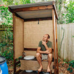 Man Who Lives in Tiny Home with No Bathroom or Running Water Shares How He Lives on $11K Per Year (Exclusive)