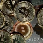 Bitcoin, crypto stocks slipping lower alongside broader markets