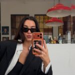 Dua Lipa Boosts High-Contrast Prints With A High-Voltage Speedy Bag